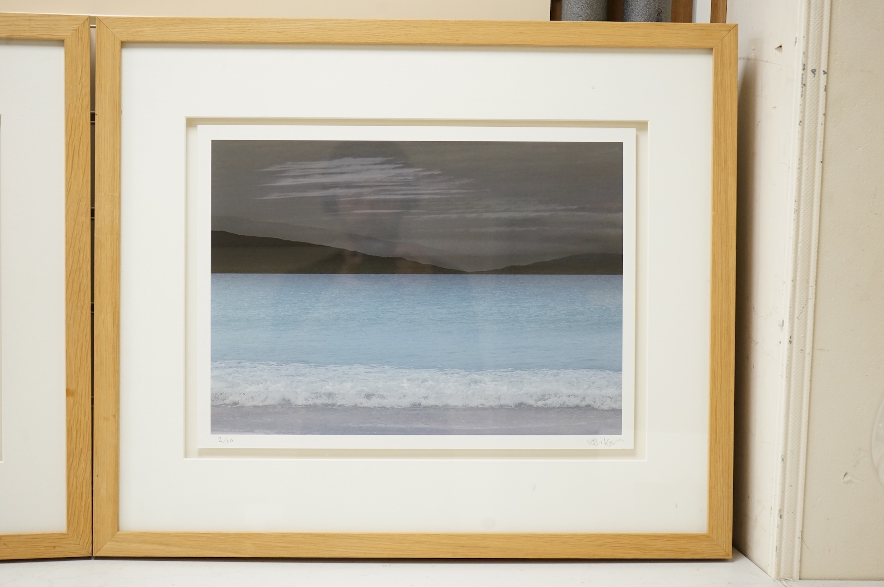Valda Bailey (Contemporary), Seascape and coastline view, signed and numbered in pencil, pair of photographic prints, 33 x 44cm